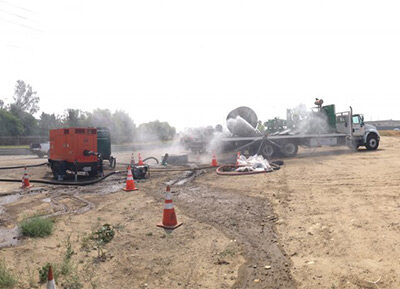 Baker tanks at extreme left, suction pump in center left.