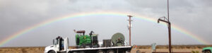 Rainbow behind WellJet truck and equipment.